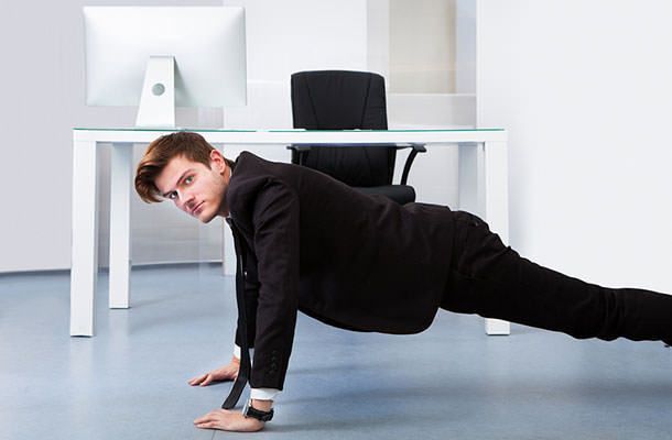 bigstock-Businessman-Doing-Pushups-65966767