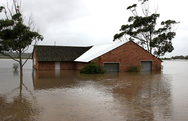 bigstock-Flooded-House-On-River-Bank-20892065