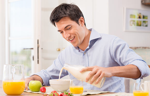 bigstock-Happy-Young-Man-Pouring-Milk-I-48108911