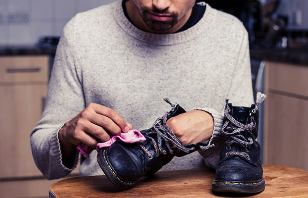 bigstock-Man-Is-Polishing-His-Boots-57902099