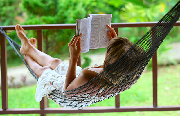 bigstock-Young-woman-reading-a-book-lyi-14022884