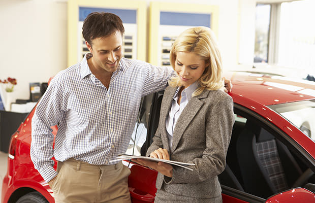 bigstock-Man-buying-new-car-67333795