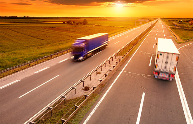 bigstock-Blue-And-White-Truck-In-Motion-70188844