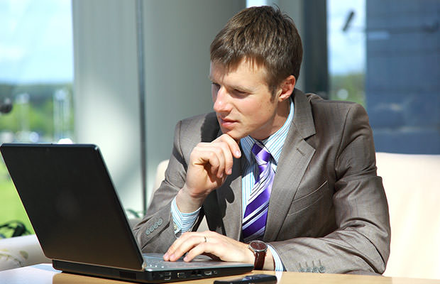 bigstock-Businessman-working-on-laptop--13867364