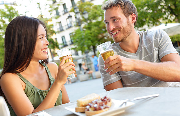 bigstock-Couple-eating-tapas-drinking-b-80792330