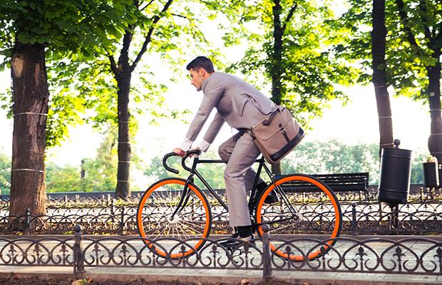 bigstock-Businessman-riding-bicycle-to--97836794