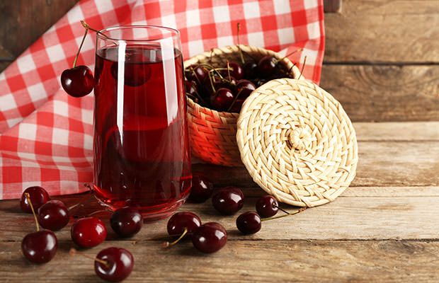 bigstock-Glass-of-cherry-juice-on-woode-98993177