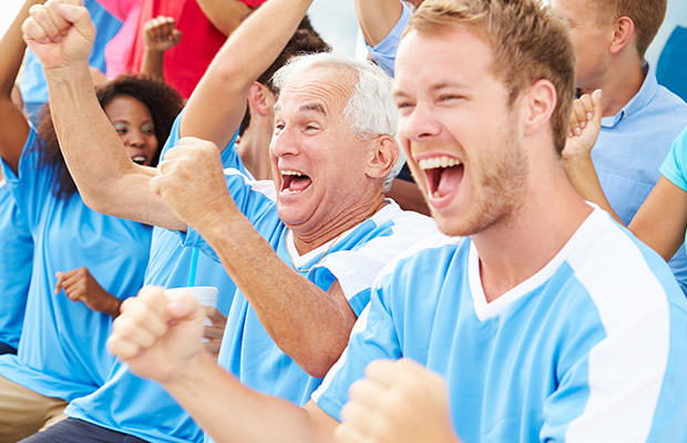 bigstock-Spectators-In-Team-Colors-Watc-64373653