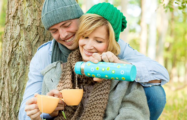 bigstock-Happy-couple-in-nature-drinkin-19420898