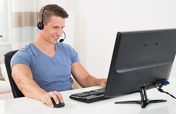 bigstock-Man-Using-Desktop-Computer-And-101231807