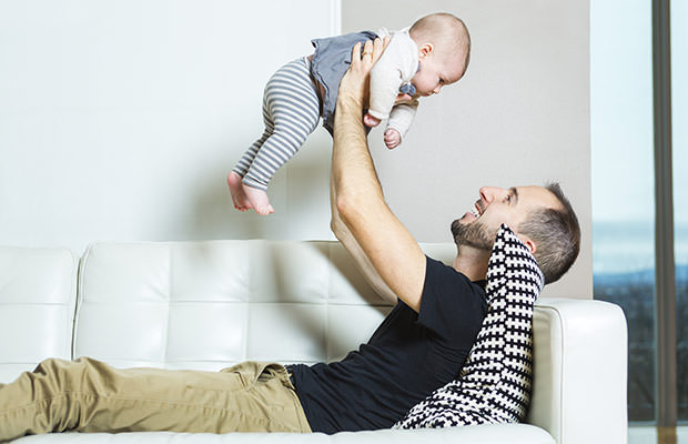 bigstock-Father-with-baby-on-the-sofa-t-108712382-f
