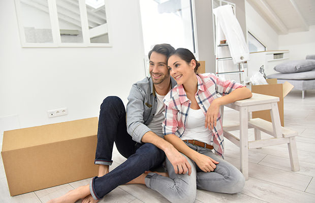 bigstock-Young-couple-moving-into-new-h-108132533